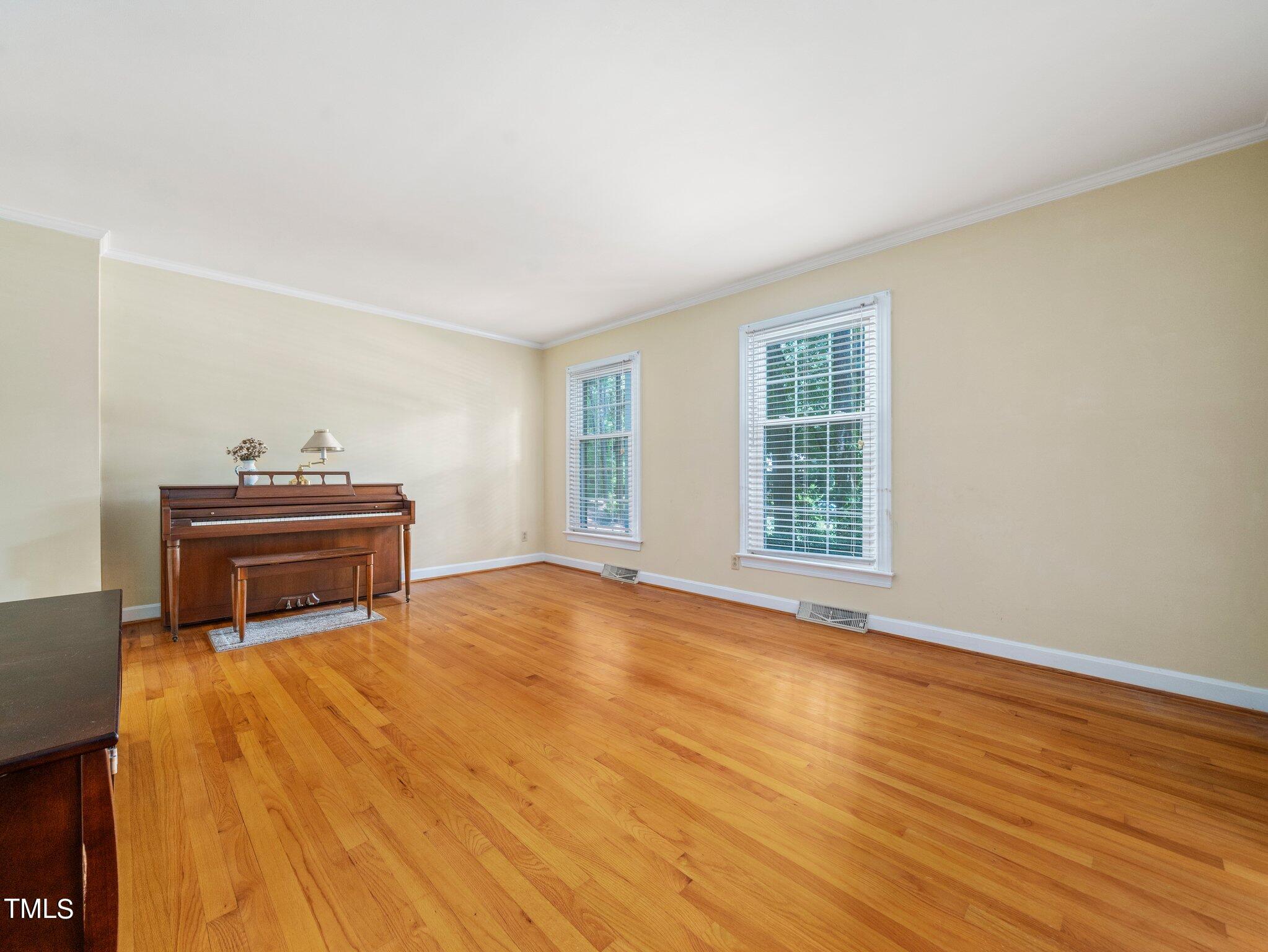 4205 Weaver Drive Raleigh, NC 27612 - Photo 10 of 48 a room with a bed and a window