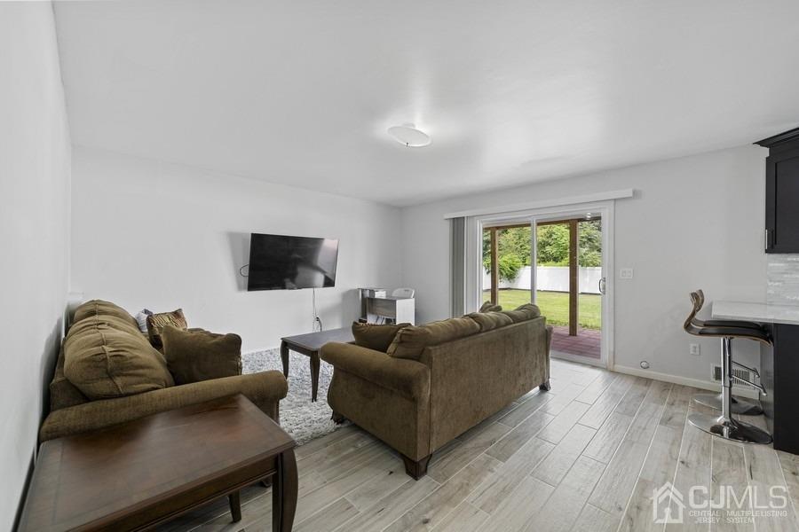 89 Normandy Drive Piscataway, NJ 08854 - Photo 11 of 20 a living room with furniture and a window