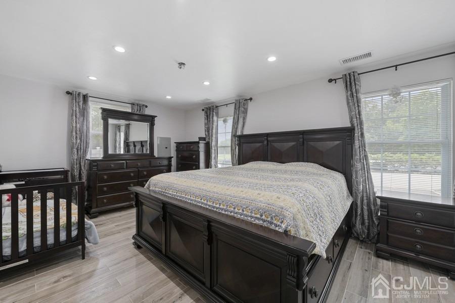 89 Normandy Drive Piscataway, NJ 08854 - Photo 14 of 20 a spacious bedroom with a bed and a dresser