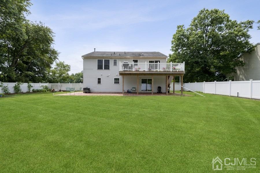 89 Normandy Drive Piscataway, NJ 08854 - Photo 20 of 20 a view of a house with a yard and sitting area