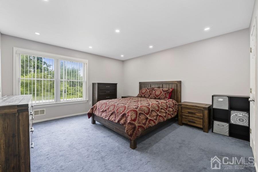 89 Normandy Drive Piscataway, NJ 08854 - Photo 7 of 20 a spacious bedroom with a bed and wooden floor