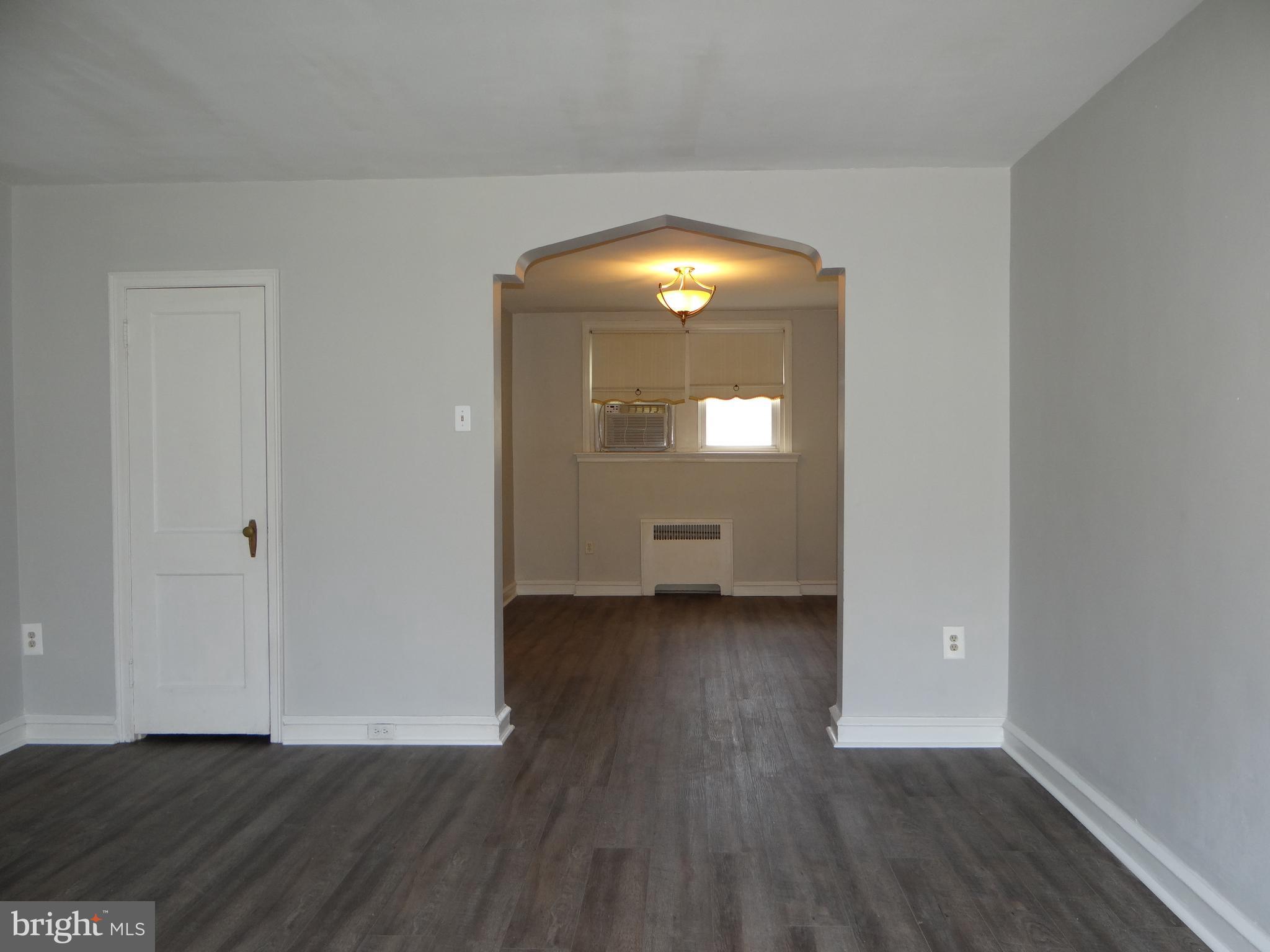 6744 Rutland Street Philadelphia, PA 19149 - Photo 14 of 44 a view of empty room with wooden floor and fan