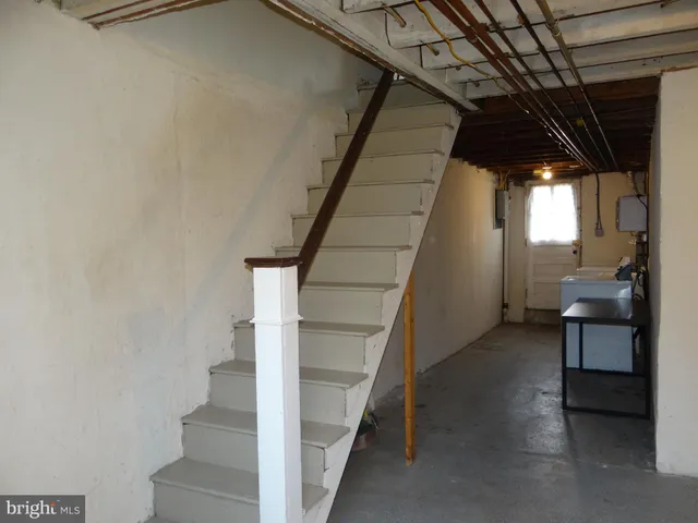 a front view of a building with a white door