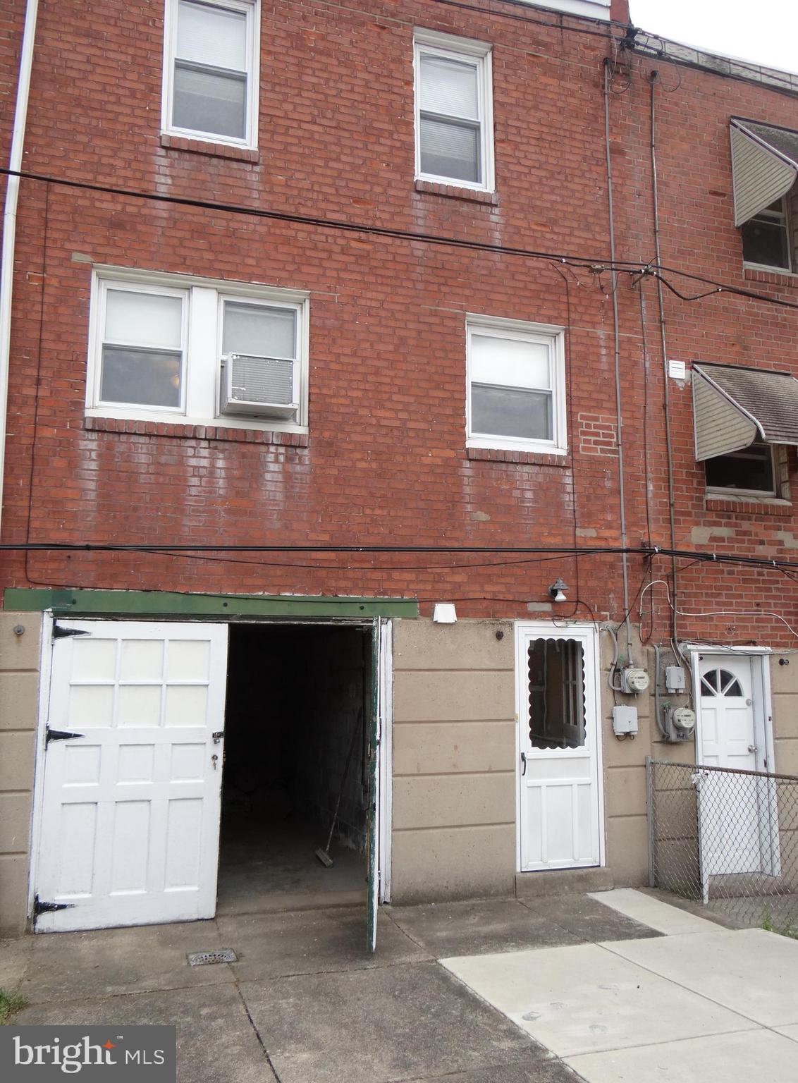 6744 Rutland Street Philadelphia, PA 19149 - Photo 40 of 44 a front view of a building with a white door
