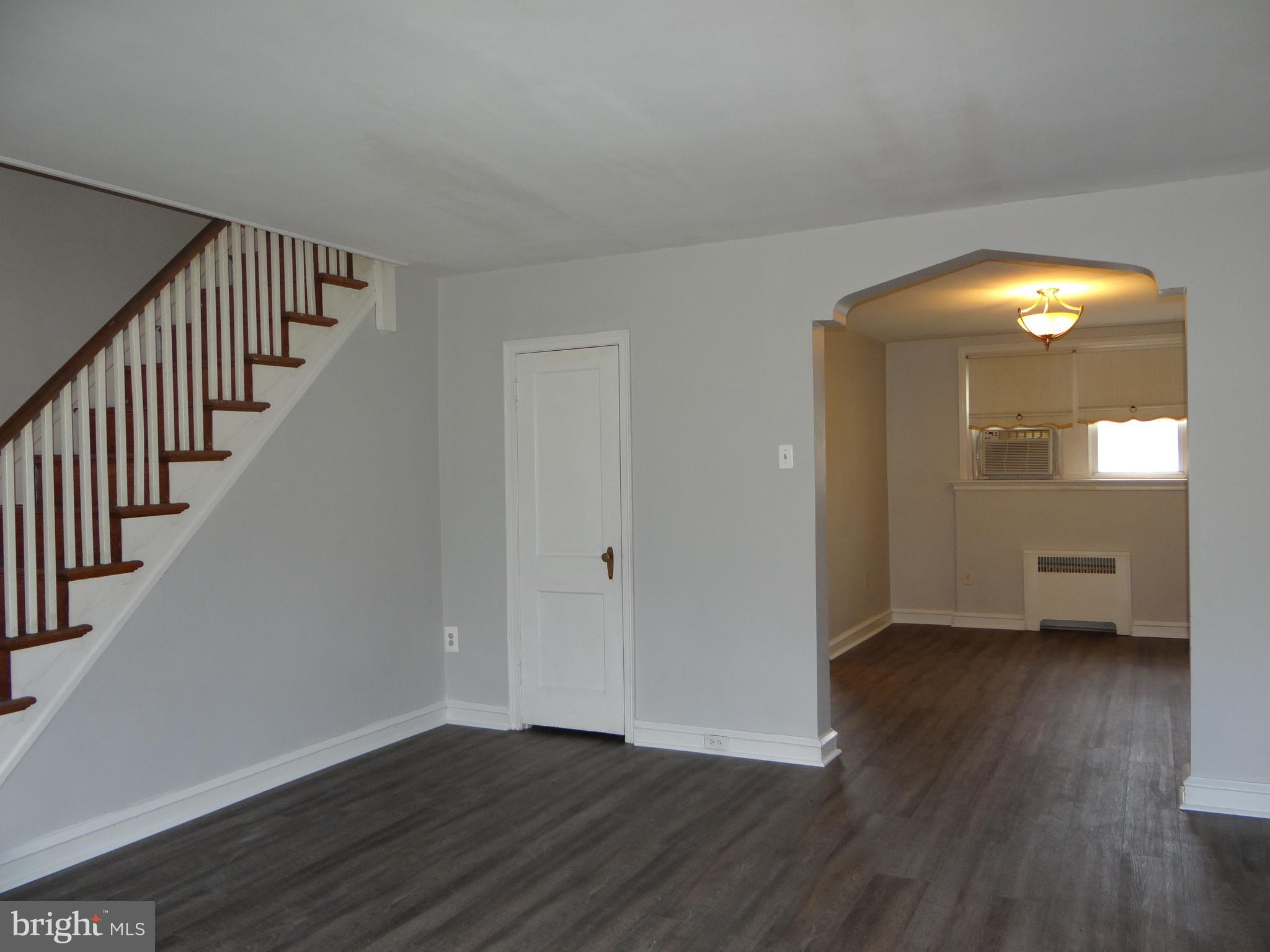 6744 Rutland Street Philadelphia, PA 19149 - Photo 9 of 44 wooden floor in an empty room with a window