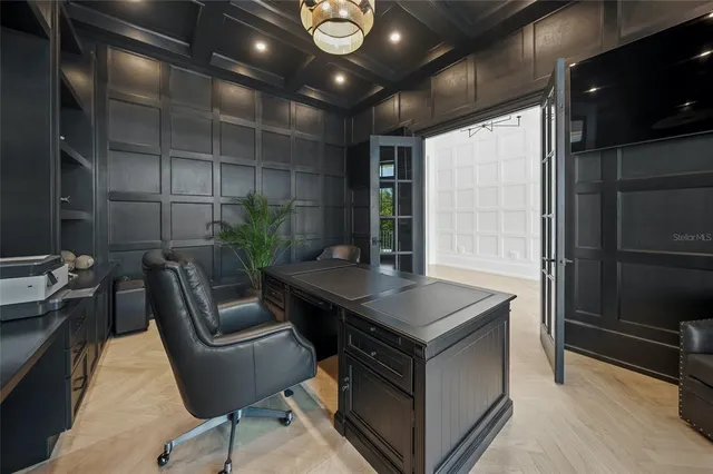 a view of a dining room with furniture large windows and wooden floor