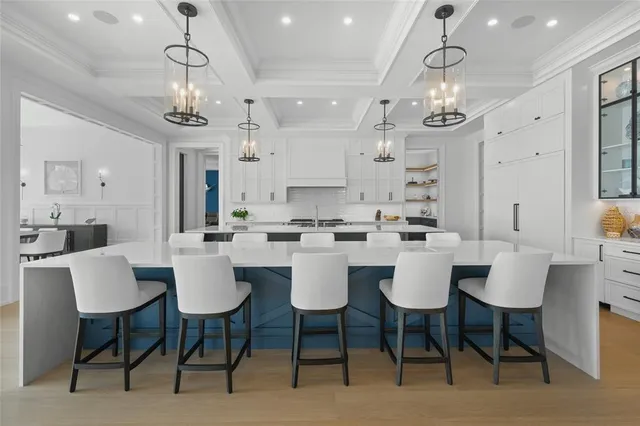 a bed sitting in a spacious bedroom next to a window