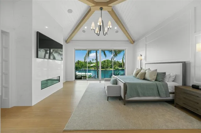 a bathroom with a double vanity sink a toilet a mirror and shower