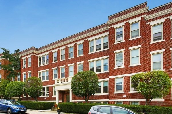 a front view of a building with garden