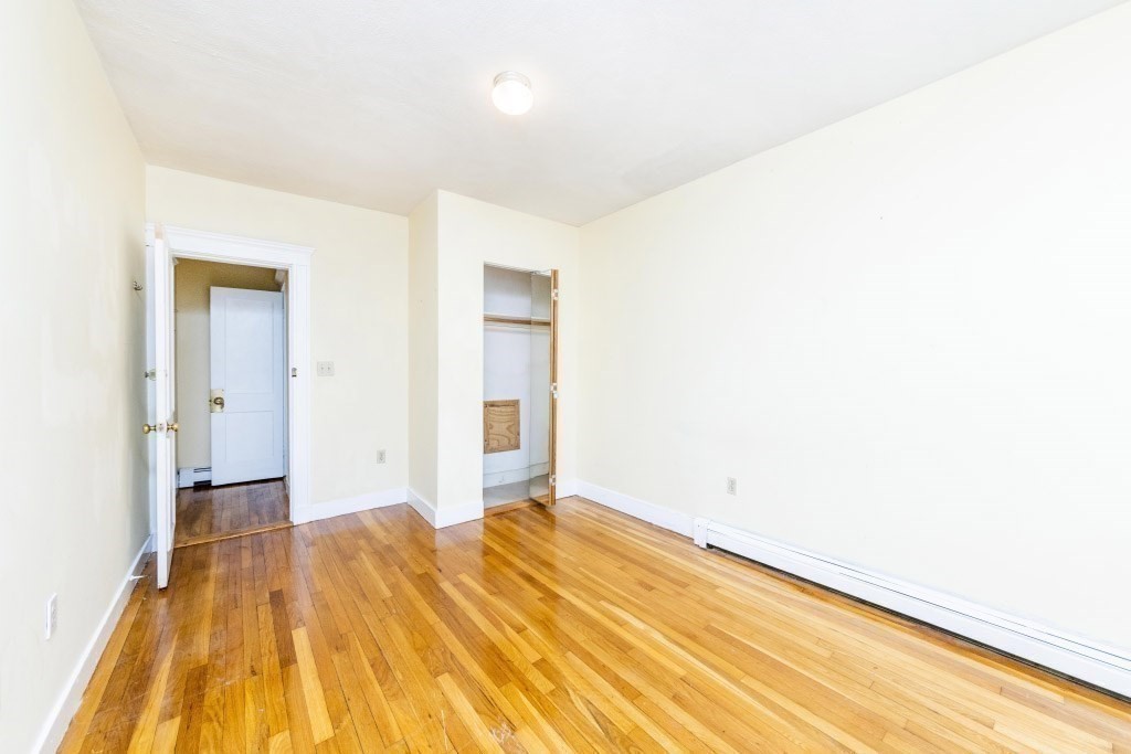 24 Ransom Road, Unit 8 Boston, MA 02135 - Photo 6 of 13 a view of a room with a wooden floor