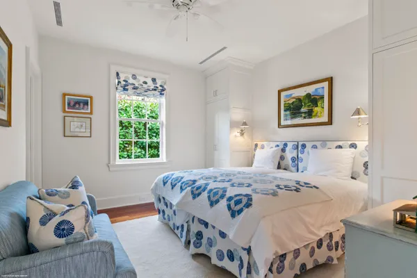 a bedroom with a bed and a couch