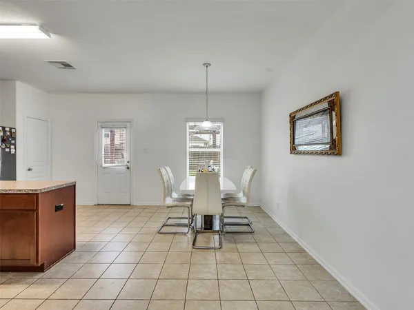 a living room with furniture a desk and chair