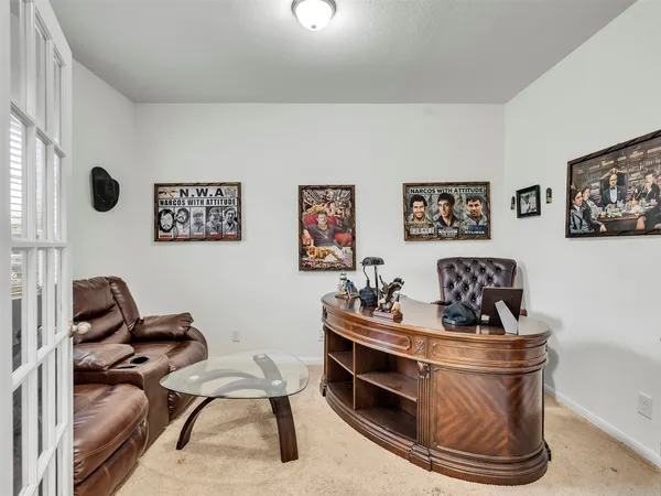 a room with furniture and air hockey table