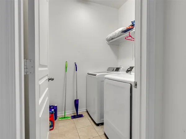a utility room with dryer and washer