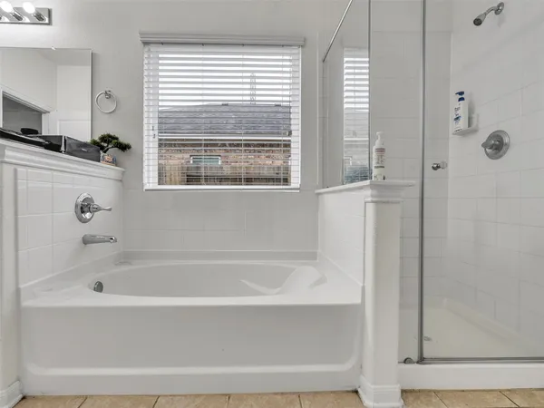 a white bath tub sitting next to a window