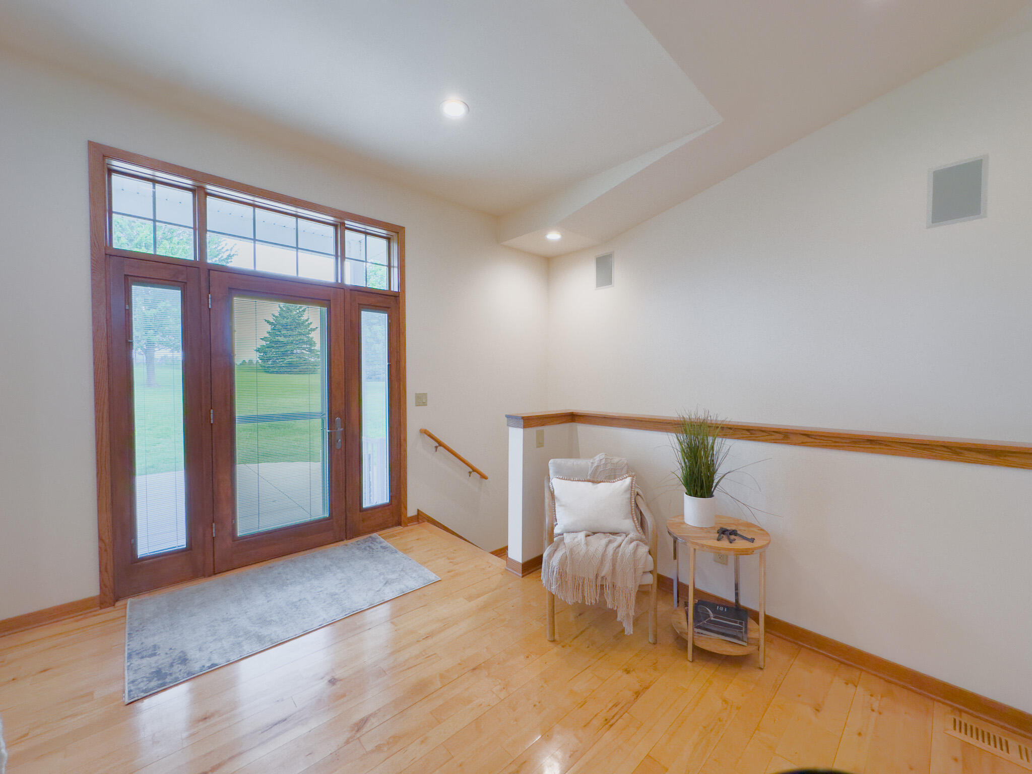 11604 North Granville Road Mequon, WI 53097 - Photo 10 of 49 Hardwood floors and stairs to the lower level.
