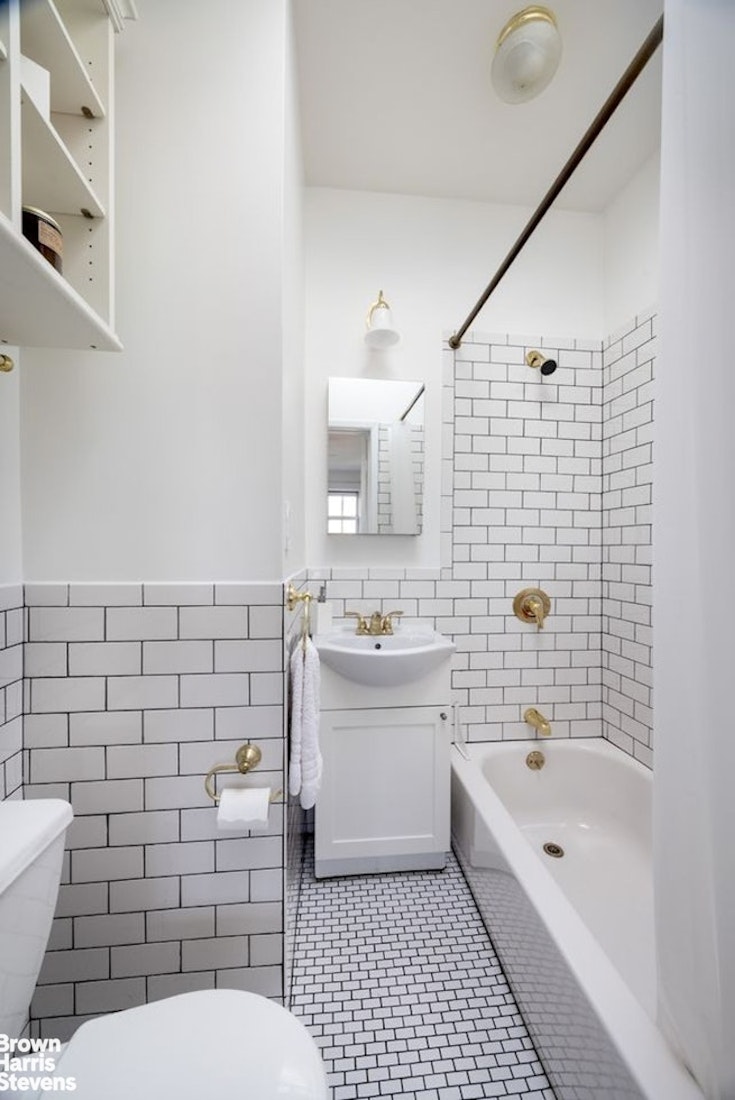 130 Henry Street, Unit 4R Brooklyn, NY 11201 - Photo 4 of 7 a bathroom with a sink a toilet and shower