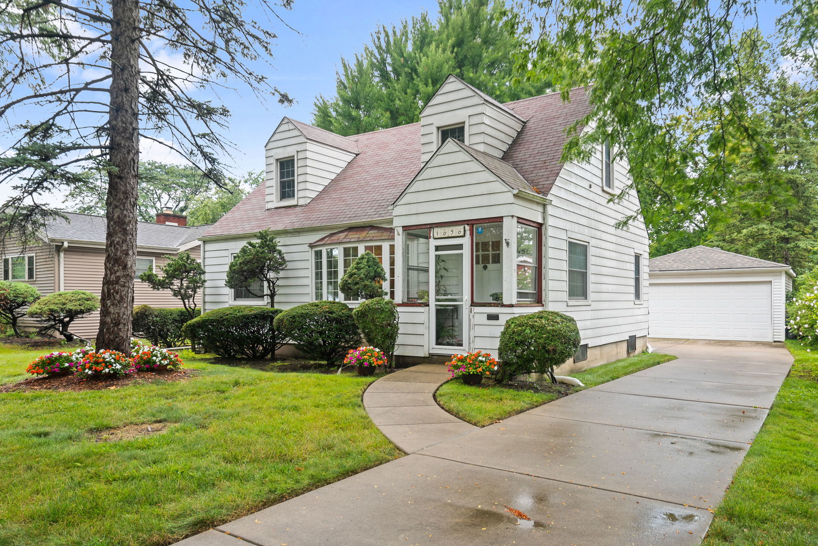 1656 Pine Road Homewood, IL 60430 - Photo 2 of 23 a view of a house with a garden and plants