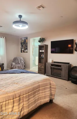 a bedroom with a bed and furniture