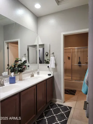 a view of backyard with a large tree