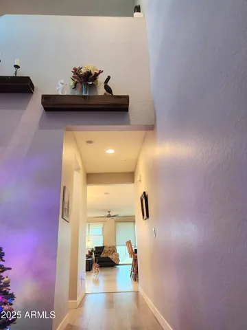 a kitchen with a refrigerator and a stove top oven