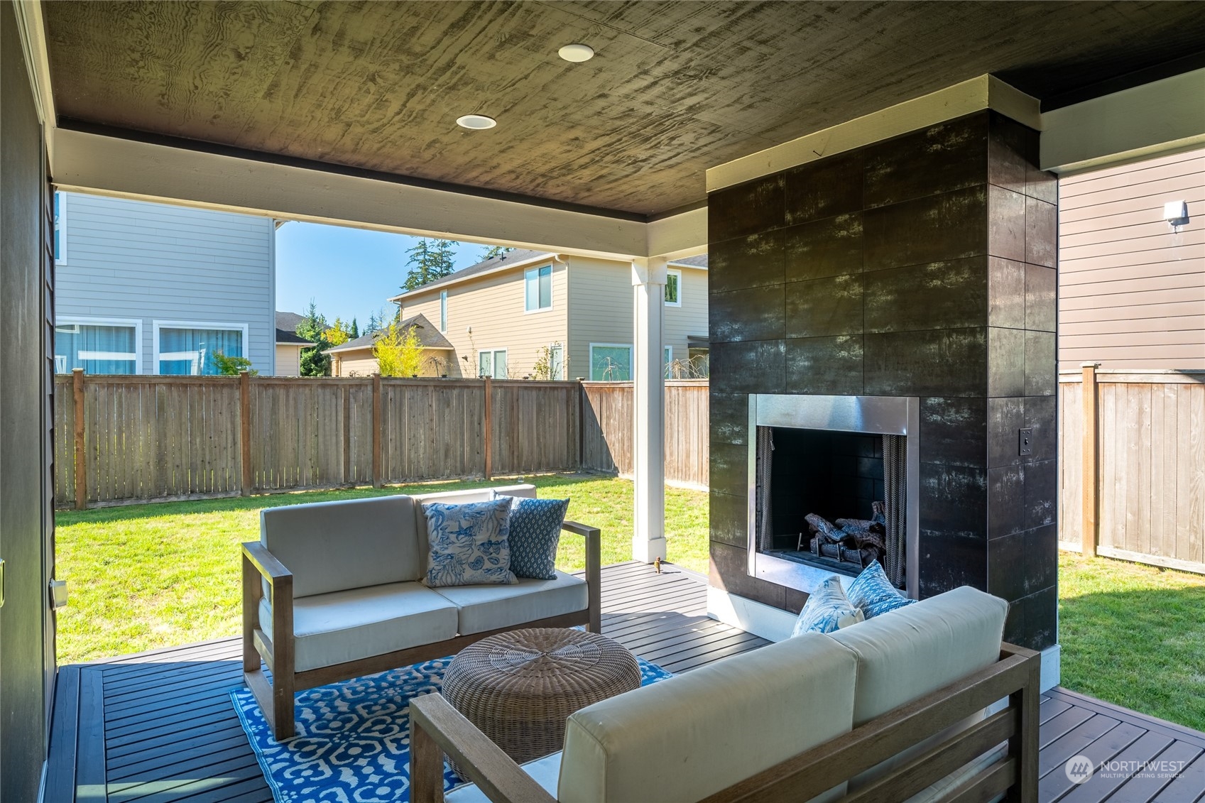 3926 171st Place Southeast Bothell, WA 98012 - Photo 32 of 40 a outdoor living space with furniture and a fireplace