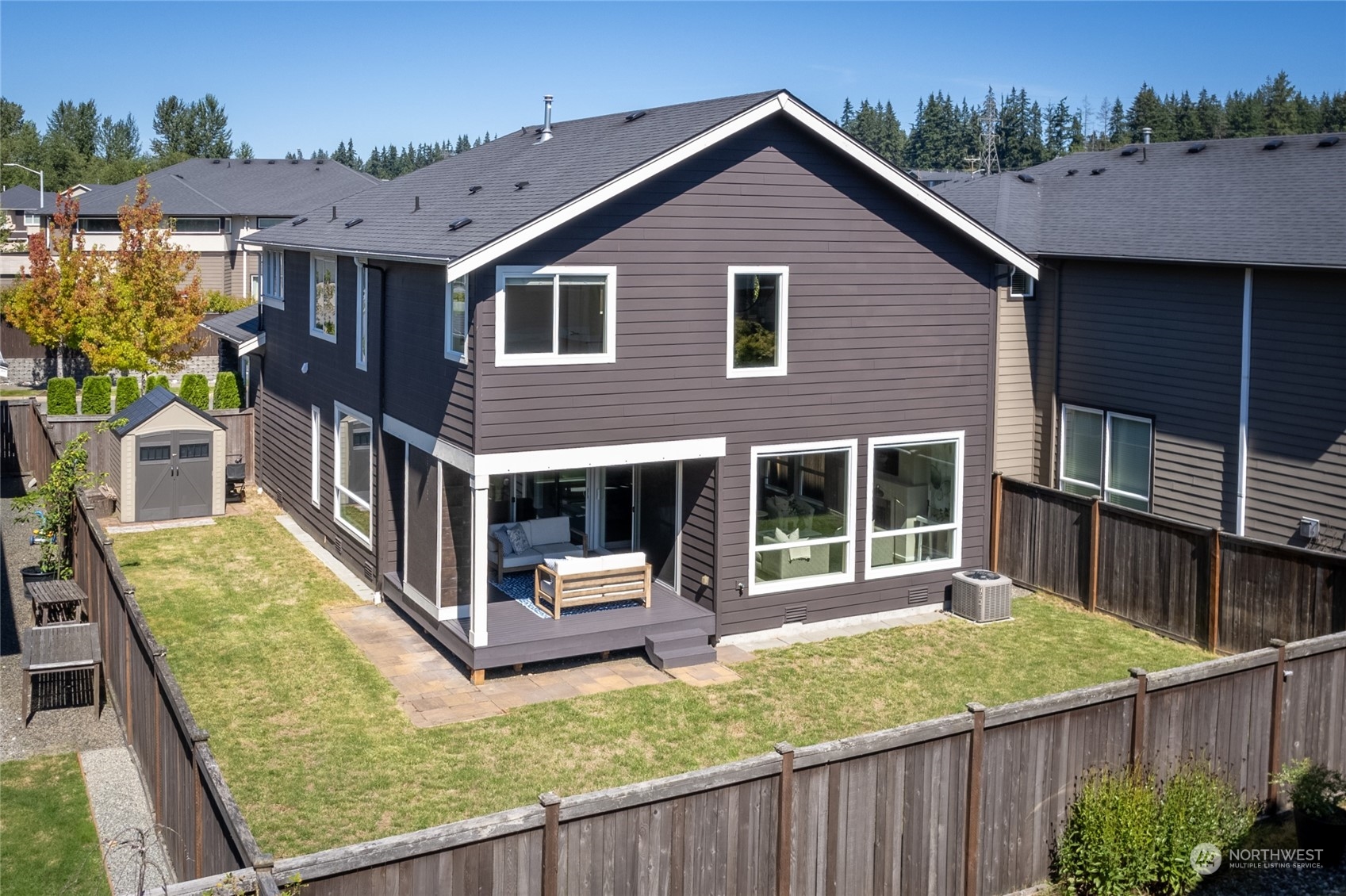 3926 171st Place Southeast Bothell, WA 98012 - Photo 34 of 40 a view of a house with wooden deck and furniture