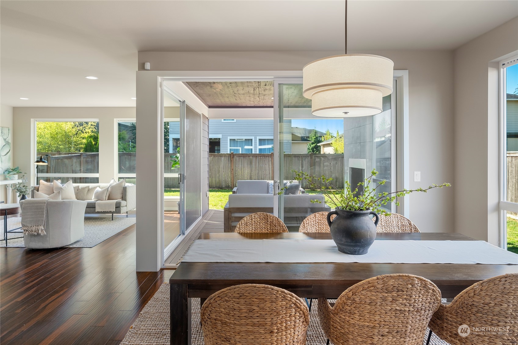 3926 171st Place Southeast Bothell, WA 98012 - Photo 8 of 40 a dining room with wooden floor and a chandelier