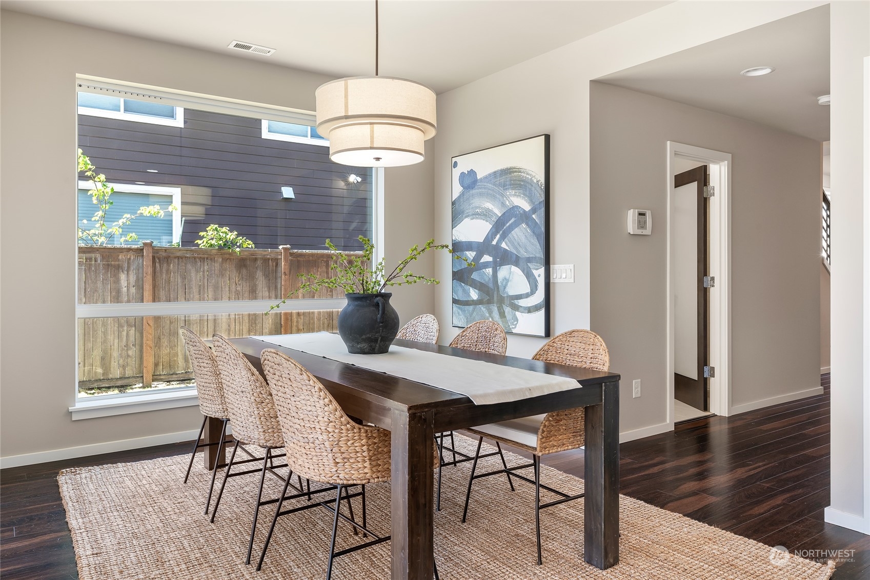3926 171st Place Southeast Bothell, WA 98012 - Photo 9 of 40 a view of a dining room with furniture window and wooden floor