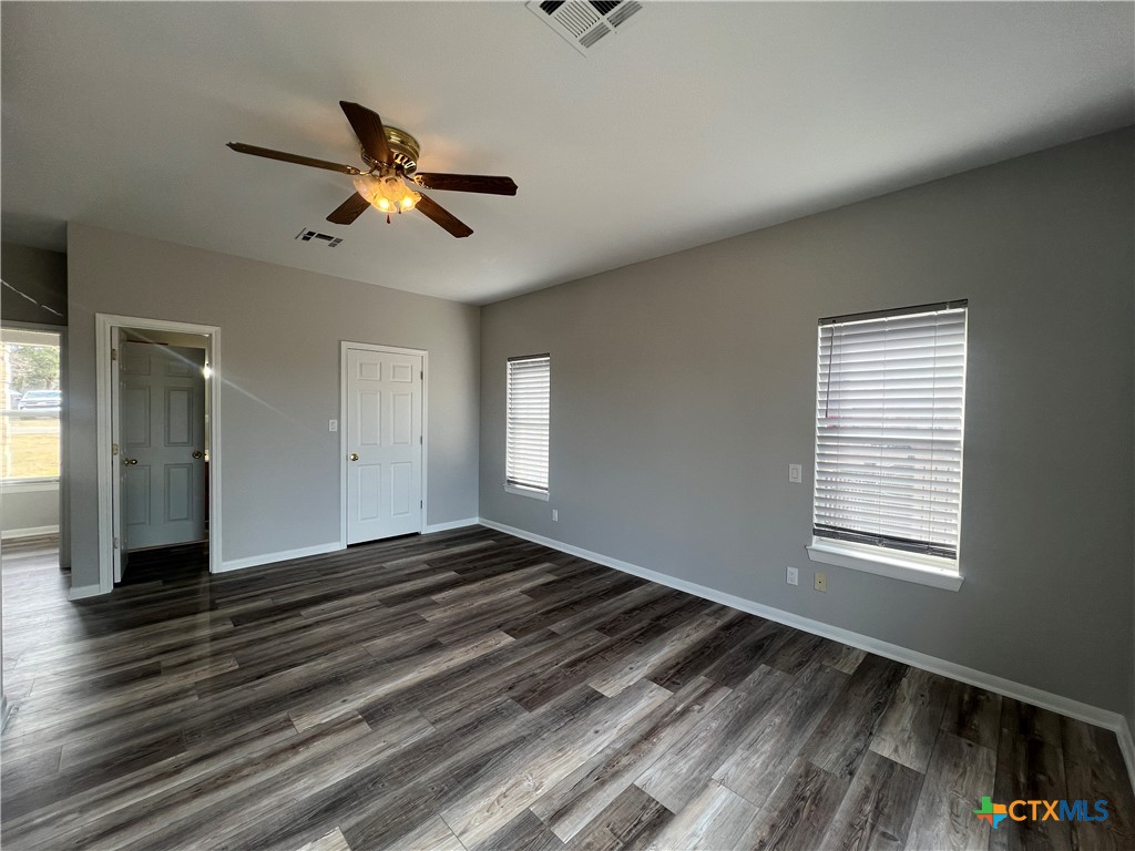 5899 Denmans Loop Belton, TX 76513 - Photo 15 of 35 a view of empty room with wooden floor and fan