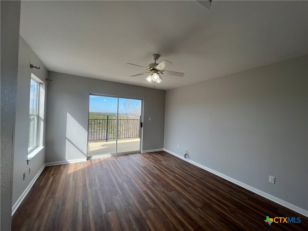 5899 Denmans Loop Belton, TX 76513 - Photo 23 of 35 wooden floor in an empty room with a window