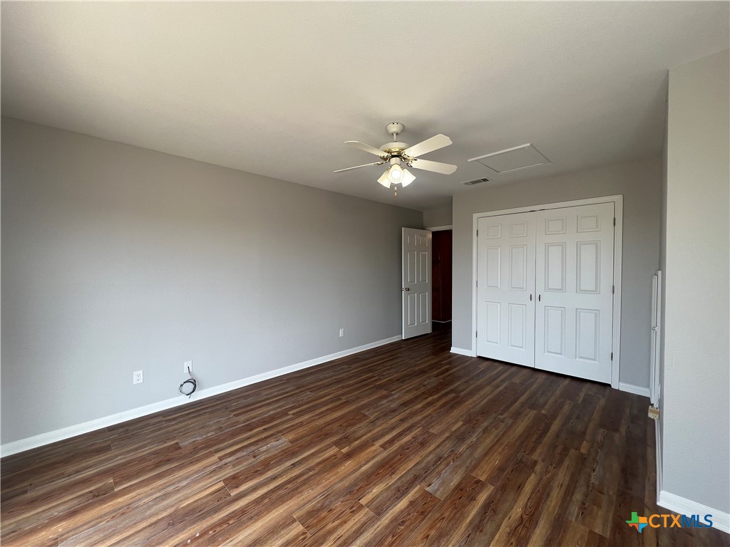 5899 Denmans Loop Belton, TX 76513 - Photo 24 of 35 a view of an empty room and wooden floor