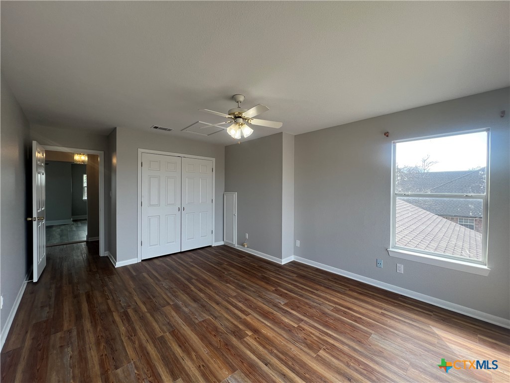 5899 Denmans Loop Belton, TX 76513 - Photo 25 of 35 wooden floor in an empty room with a window