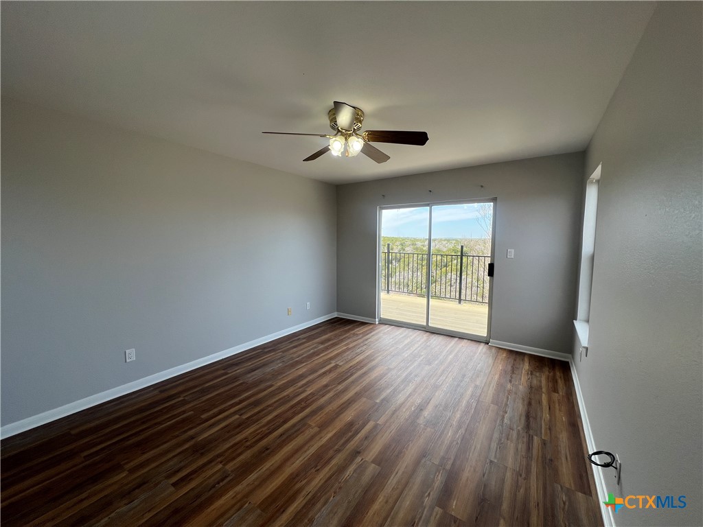 5899 Denmans Loop Belton, TX 76513 - Photo 28 of 35 wooden floor in an empty room with a window