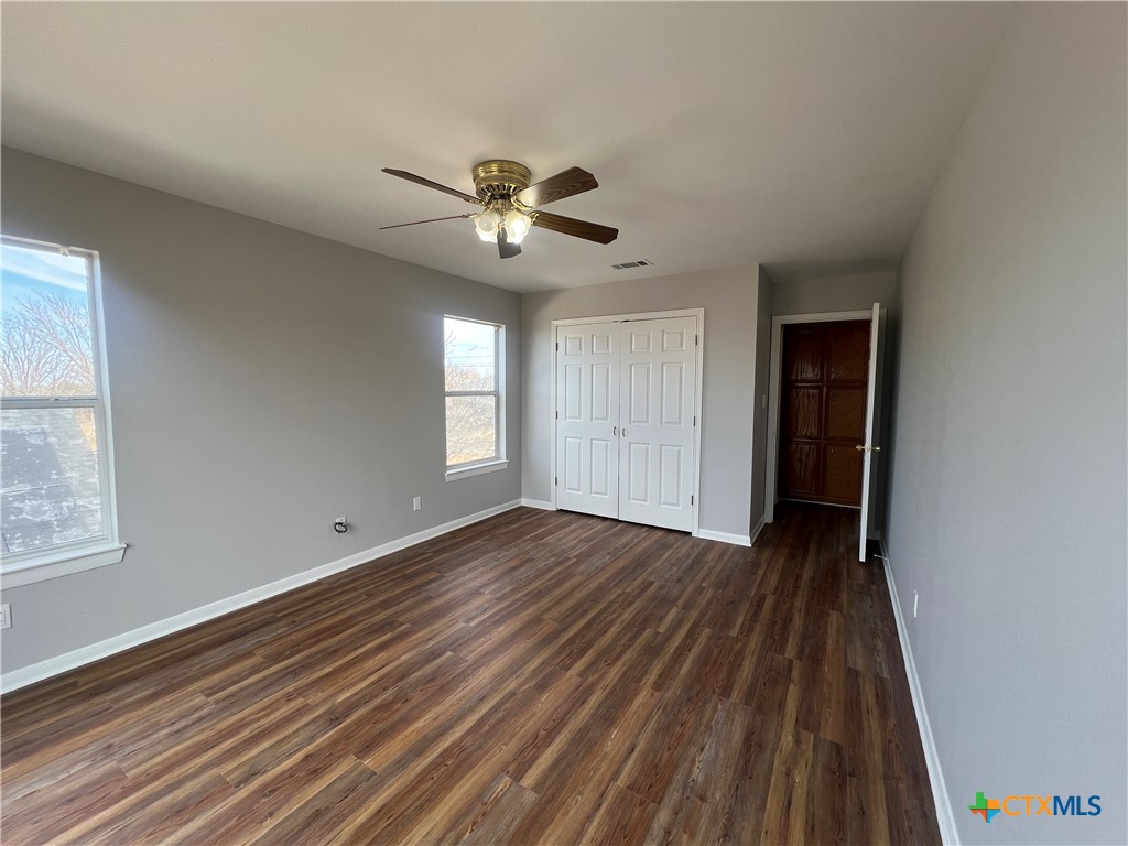 5899 Denmans Loop Belton, TX 76513 - Photo 30 of 35 a view of empty room with wooden floor and fan