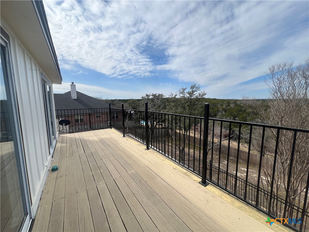 5899 Denmans Loop Belton, TX 76513 - Photo 33 of 35 a view of balcony with wooden floor and fence