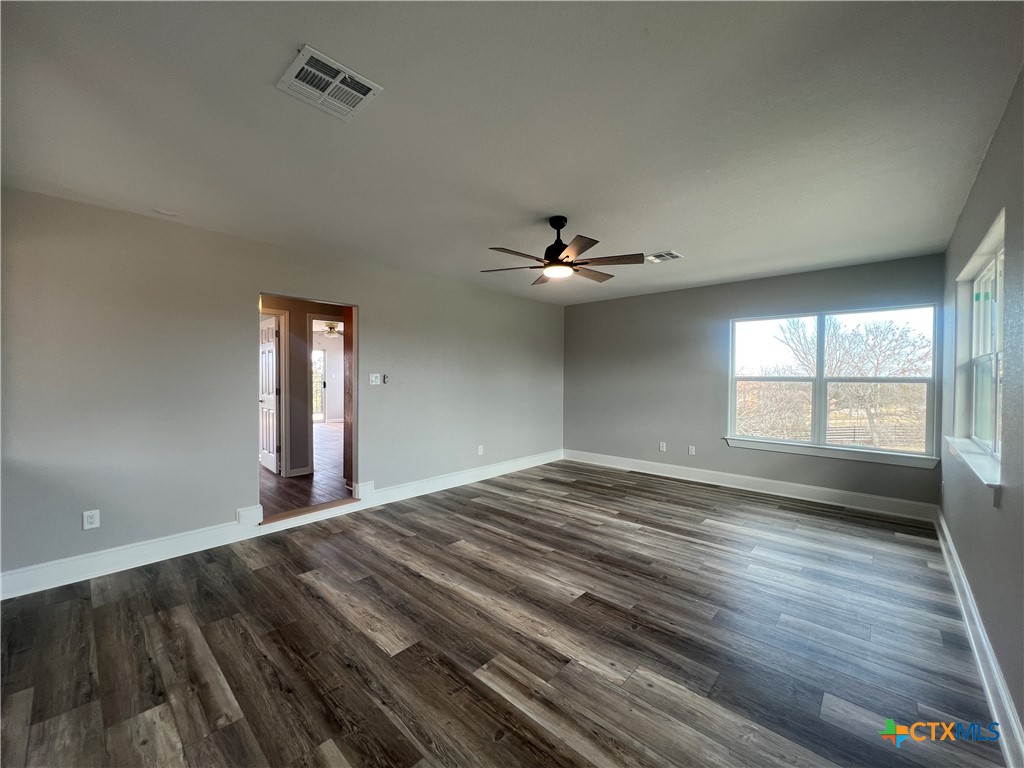 5899 Denmans Loop Belton, TX 76513 - Photo 35 of 35 a view of empty room with wooden floor and fan