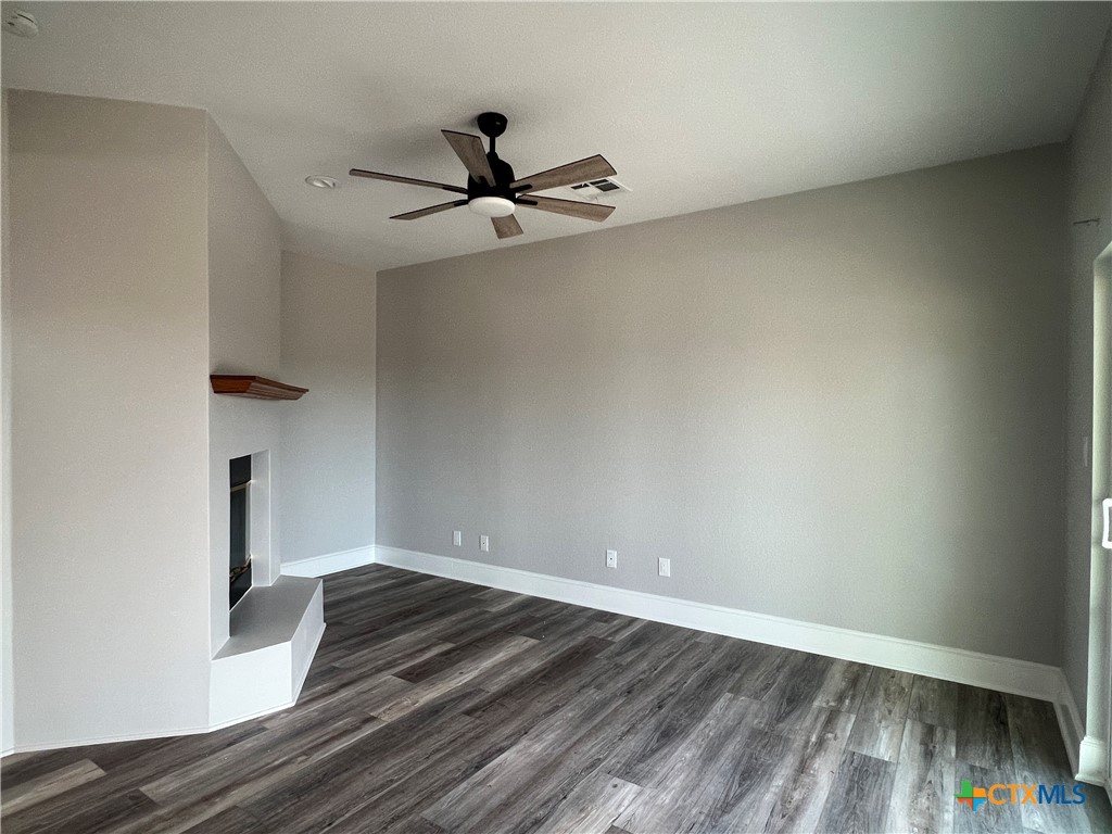 5899 Denmans Loop Belton, TX 76513 - Photo 5 of 35 a view of empty room with wooden floor