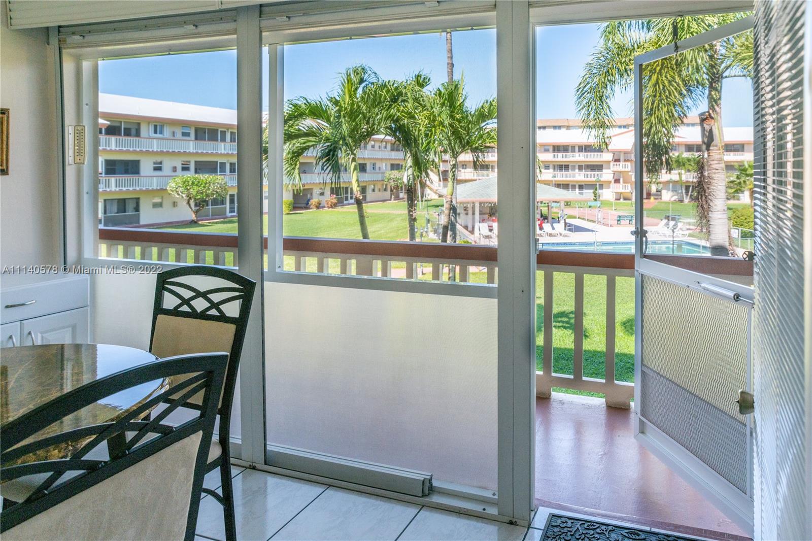 5300 Washington Street, Unit A234 Hollywood, FL 33021 - Photo 14 of 42 a view of a hallway with wooden floor and dining room
