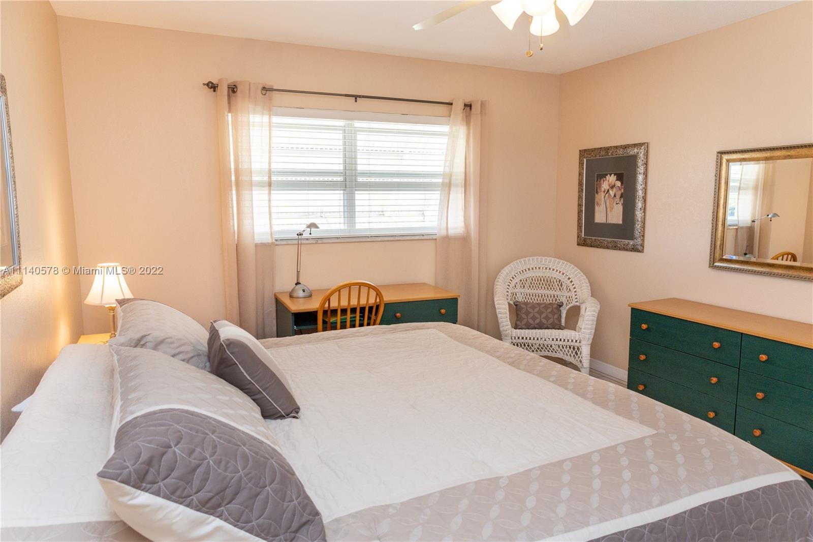 5300 Washington Street, Unit A234 Hollywood, FL 33021 - Photo 19 of 42 a bedroom with a bed and a dresser