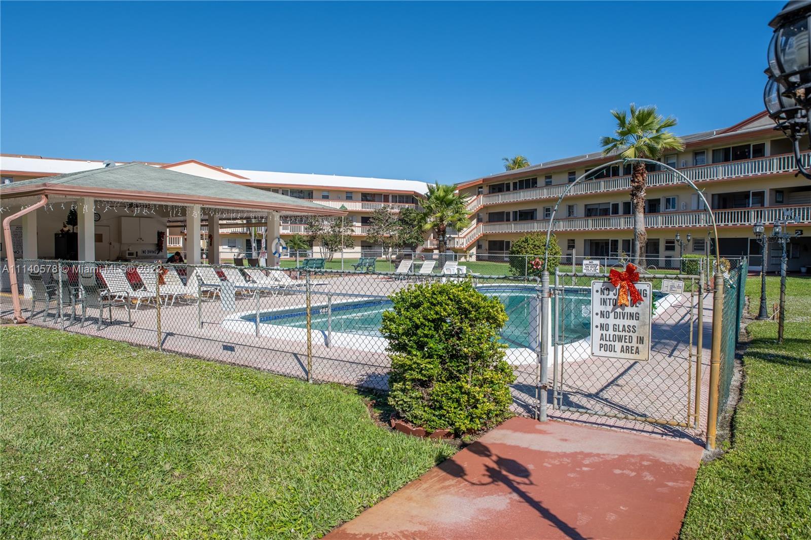 5300 Washington Street, Unit A234 Hollywood, FL 33021 - Photo 25 of 42 a view of a chairs and table in backyard of the house