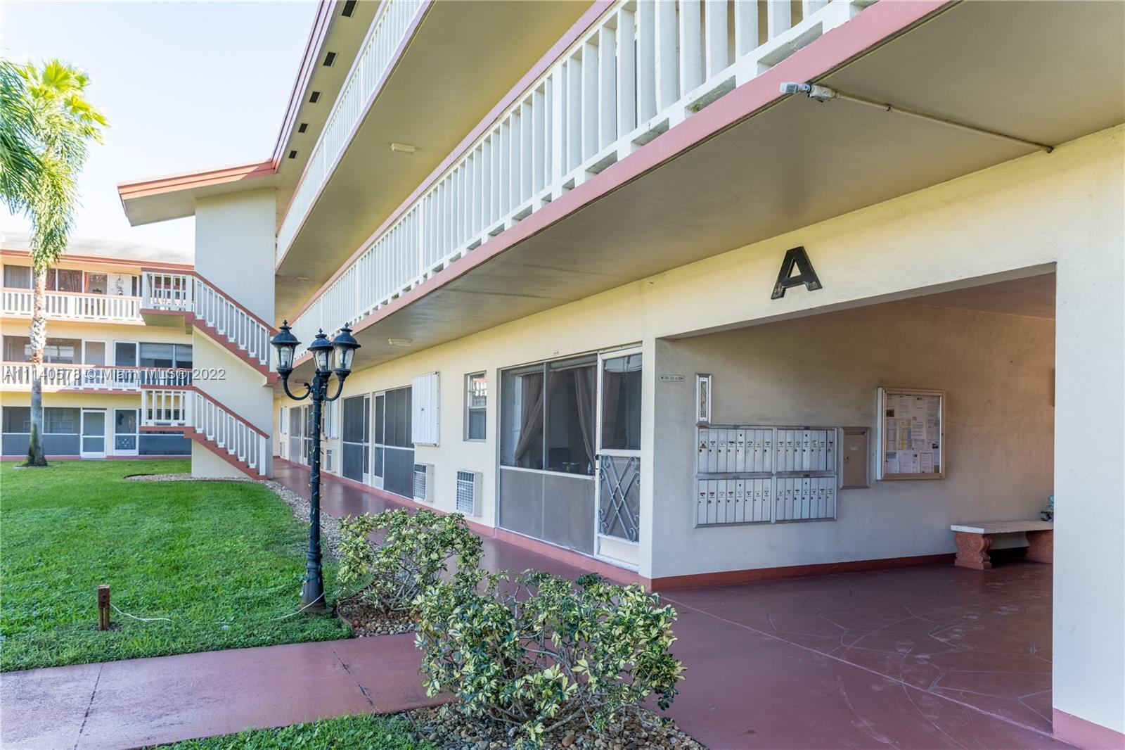 5300 Washington Street, Unit A234 Hollywood, FL 33021 - Photo 27 of 42 a view of front door and small yard