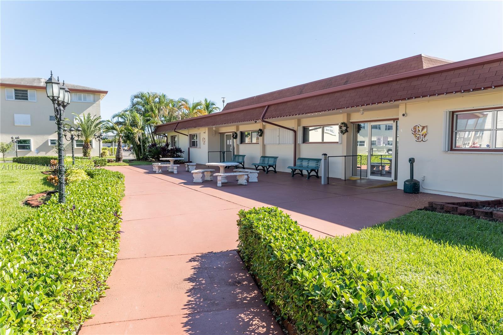5300 Washington Street, Unit A234 Hollywood, FL 33021 - Photo 32 of 42 a front view of a house with a yard