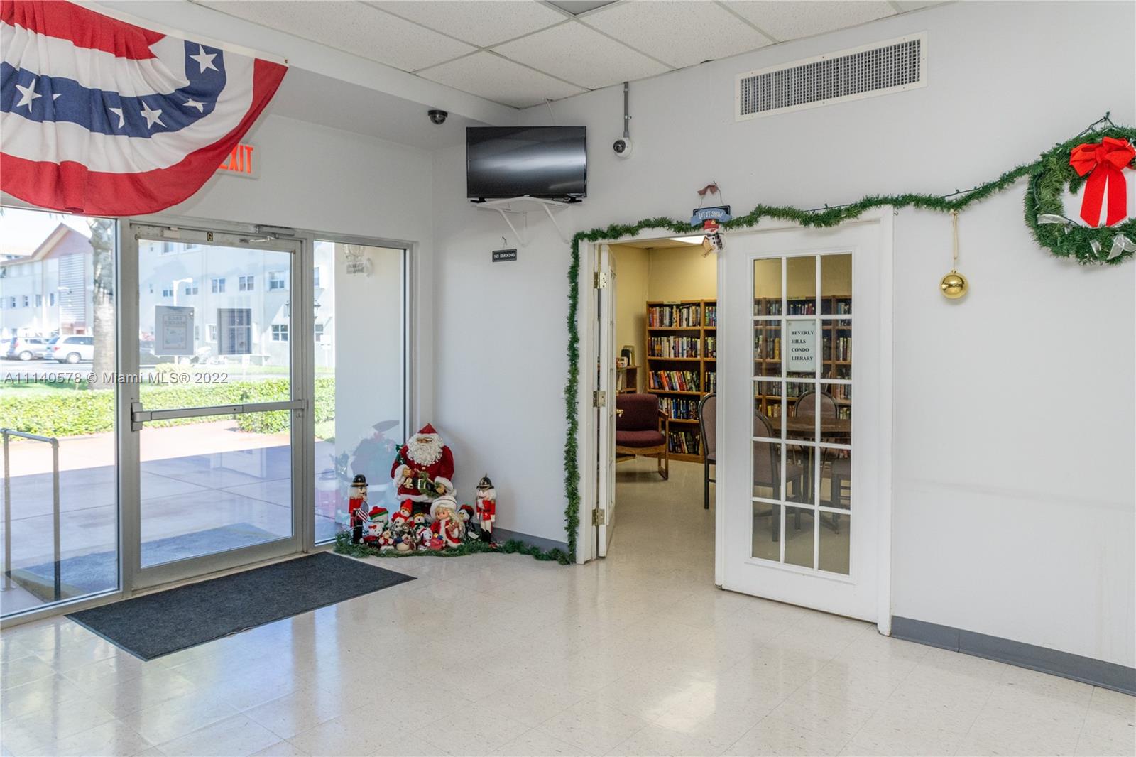 5300 Washington Street, Unit A234 Hollywood, FL 33021 - Photo 35 of 42 a very nice looking room with a large window and flat screen tv