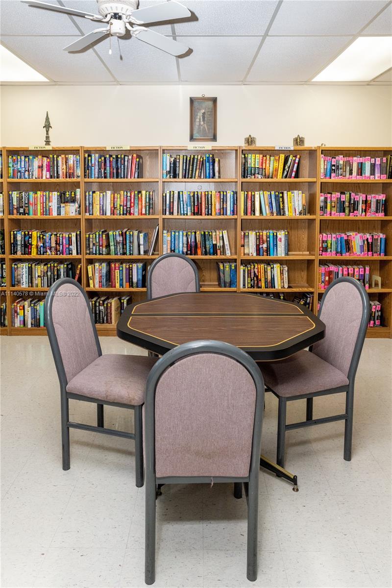 5300 Washington Street, Unit A234 Hollywood, FL 33021 - Photo 36 of 42 a reading room with furniture and book shelf