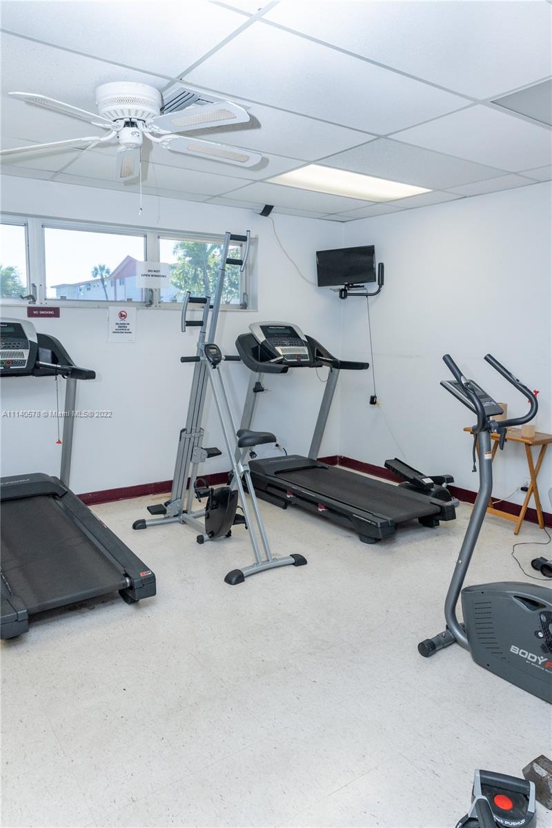 5300 Washington Street, Unit A234 Hollywood, FL 33021 - Photo 39 of 42 a room with gym equipment and a window