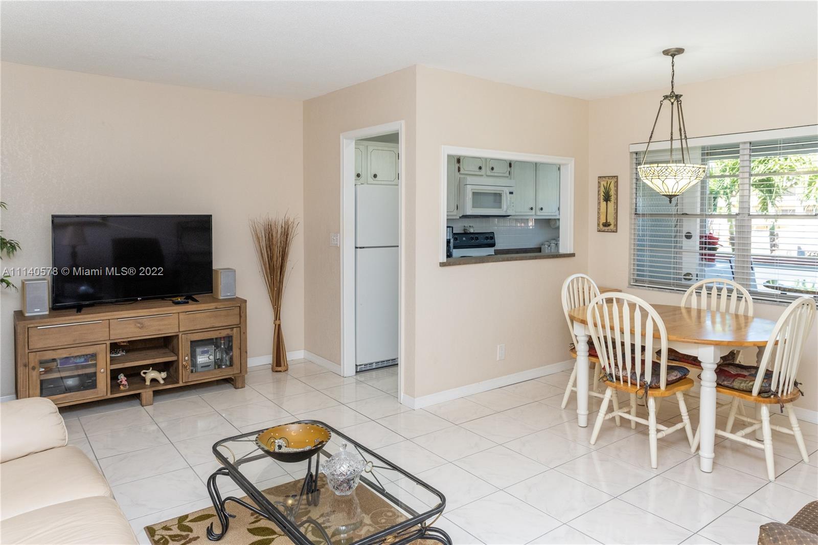 5300 Washington Street, Unit A234 Hollywood, FL 33021 - Photo 8 of 42 a living room with furniture and a flat screen tv