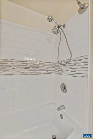 a bedroom with bed and a bookshelf