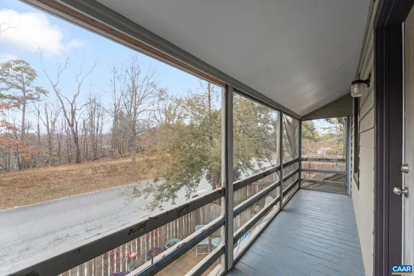 a view of a balcony with wooden floor