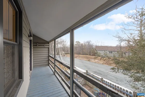 a view of a chair and tables on the terrace